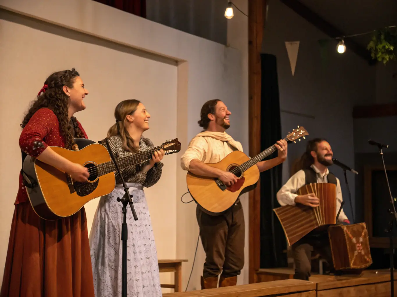 A photograph capturing a lively traditional music performance in a community hall, featuring musicians playing folk instruments and audience members of all ages clapping and dancing.